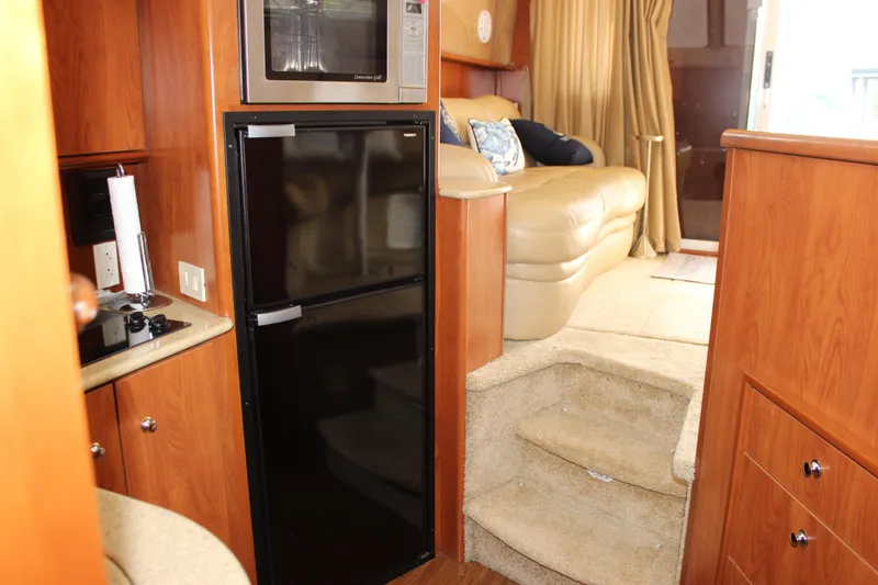 Slide: The Image of Interior of 2007 Silverton 36 Convertible yacht with kitchen and seating area. - 39
