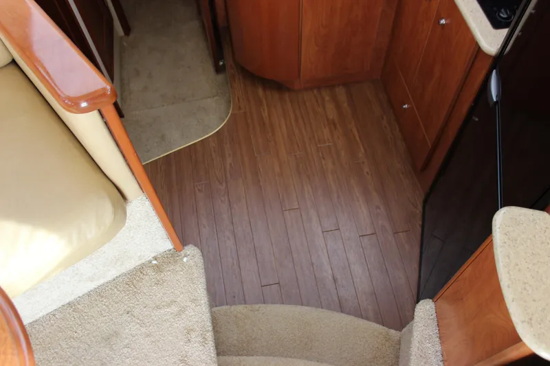 Slide: The Image of Interior view of 2007 Silverton 36 Convertible yacht with wooden flooring and carpeted stairs. - 41