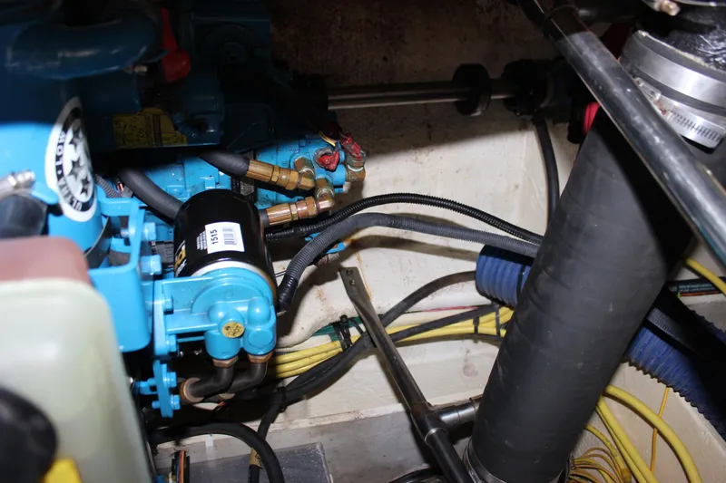 Slide: The Image of Engine compartment of a 2007 Silverton 36 Convertible boat, showing mechanical components and wiring. - 45