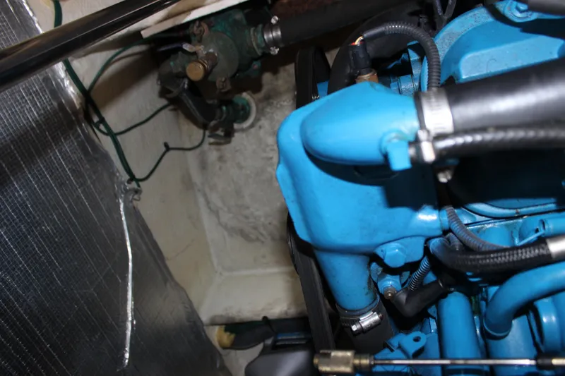 Slide: The Image of Engine compartment of a 2007 Silverton 36 Convertible boat, featuring blue engine components. - 47