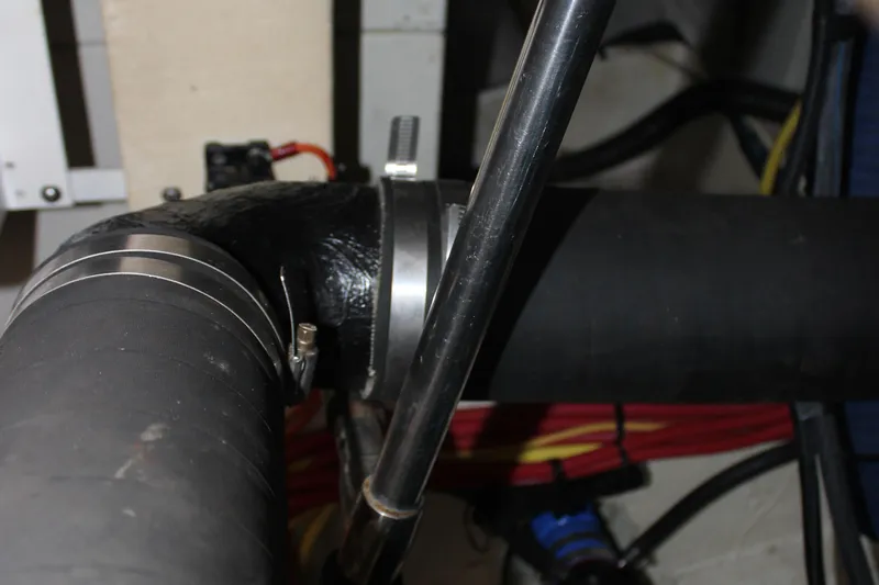 Slide: The Image of Engine compartment of 2007 Silverton 36 Convertible, showing hoses and metal fittings. - 48