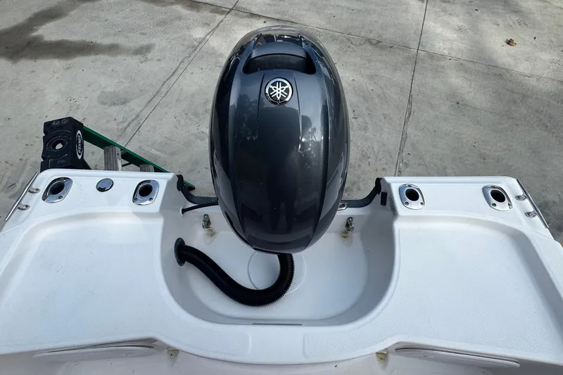 Slide: The Image of 2016 Edgewater 158CS boat with Yamaha outboard motor on concrete surface. - 8
