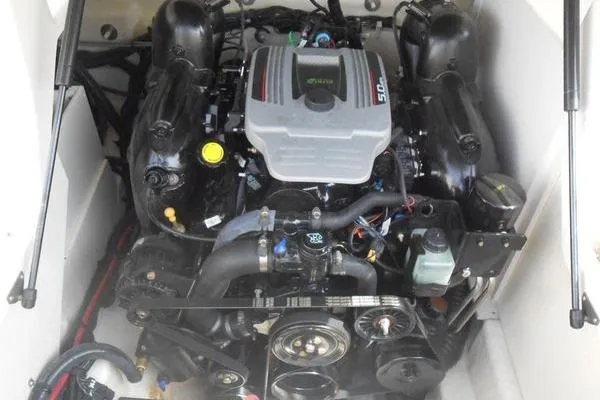 Slide: The Image of Engine compartment of a 2013 Sea Ray 220 Sundeck boat, showcasing detailed components. - 13
