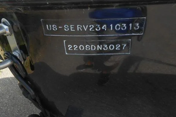 Slide: The Image of 2013 Sea Ray 220 Sundeck boat with visible serial numbers on the hull. - 15