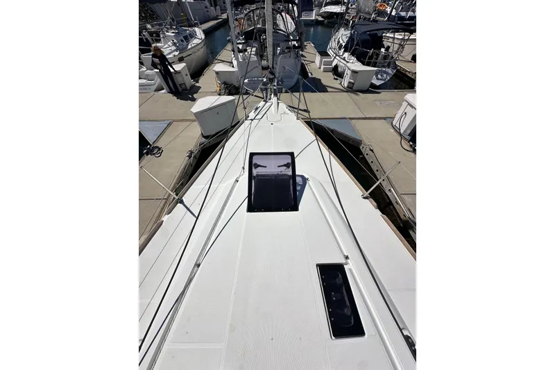 Slide: The Image of 2015 Jeanneau Sun Odyssey 409 sailboat deck with rigging in marina. - 15