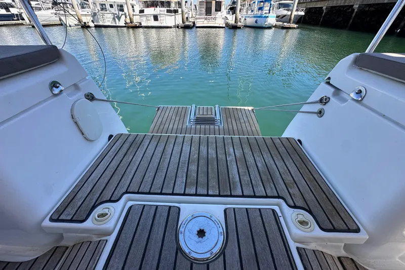 Slide: The Image of 2015 Jeanneau Sun Odyssey 409 sailboat cockpit with dual steering wheels in marina. - 25