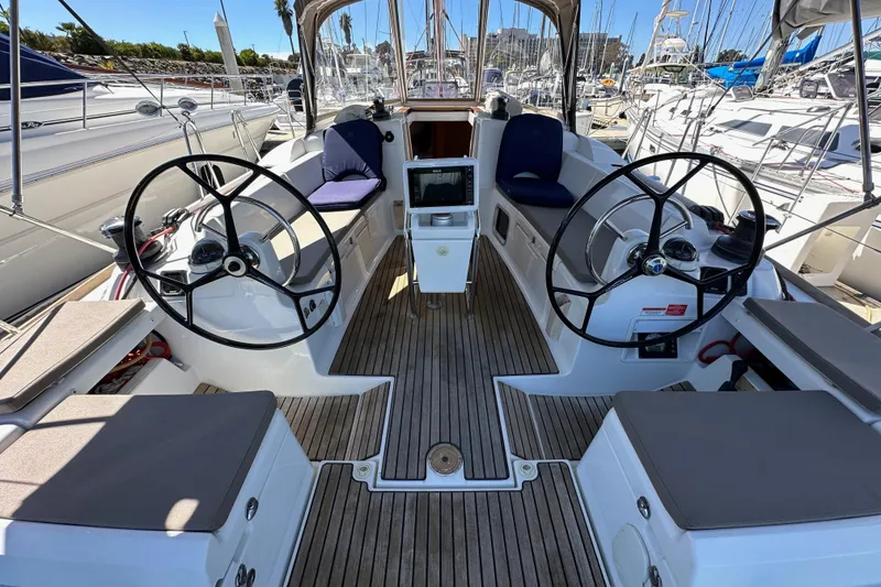 Slide: The Image of Cockpit view of 2015 Jeanneau Sun Odyssey 409 sailboat docked at marina. - 26