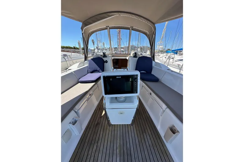 Slide: The Image of Steering wheel of 2015 Jeanneau Sun Odyssey 409 sailboat, docked in marina. - 31