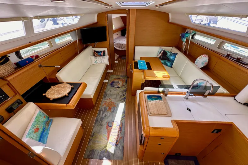 Slide: The Image of Cockpit view of 2015 Jeanneau Sun Odyssey 409 sailboat, featuring winch and control panel. - 39