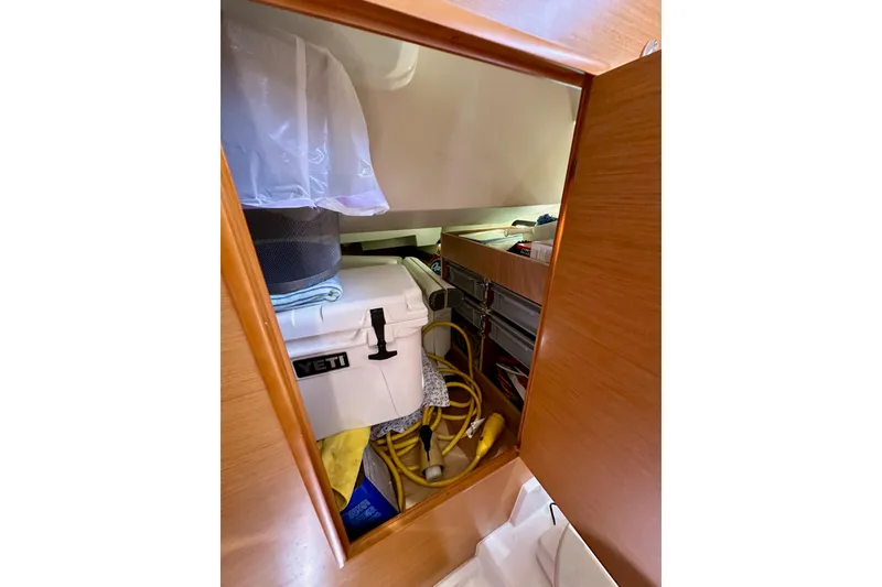 Slide: The Image of 2015 Jeanneau Sun Odyssey 409 yacht bathroom with wooden cabinetry and modern fixtures. - 53