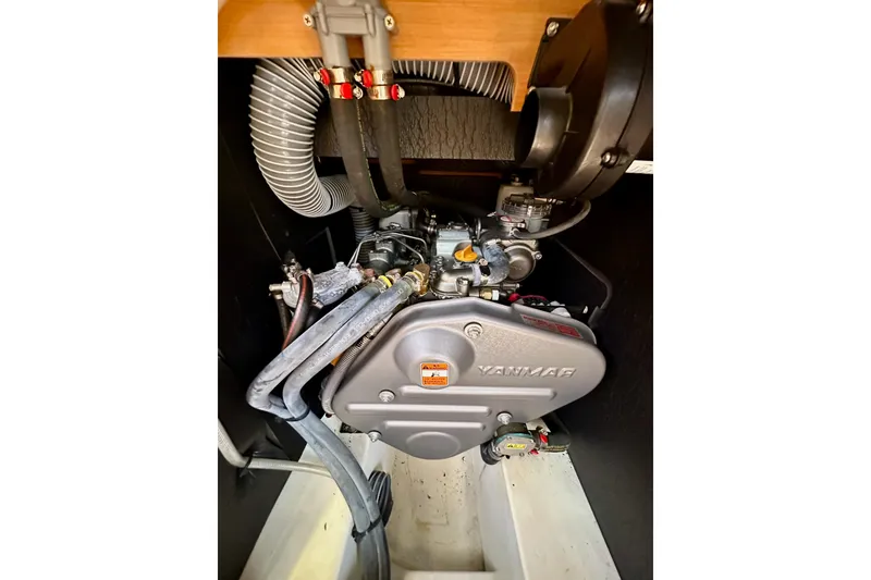 Slide: The Image of Interior of 2015 Jeanneau Sun Odyssey 409 sailboat, featuring elegant wood finish and cozy seating. - 70