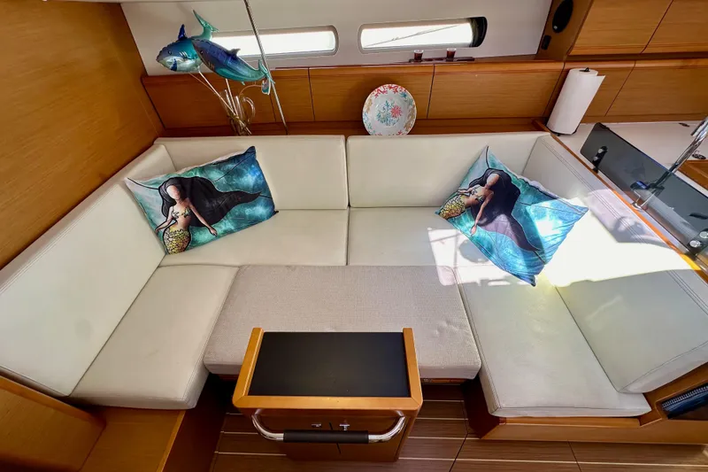 Slide: The Image of Cozy interior of 2015 Jeanneau Sun Odyssey 409 with mermaid-themed pillows and elegant decor. - 77