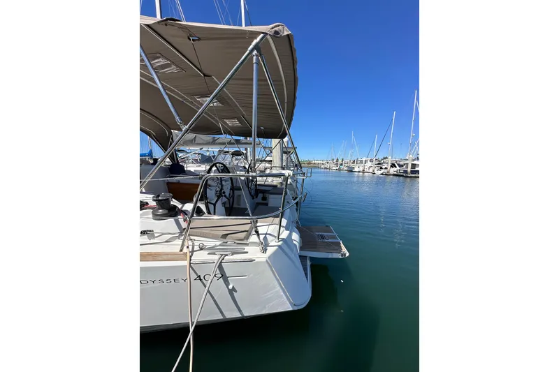 Slide: The Image of 2015 Jeanneau Sun Odyssey 409 sailboat docked at marina under clear blue sky. - 9