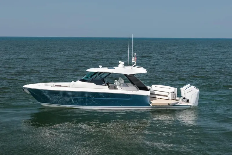 The Image of 2026 Tiara Yachts 39 model cruising on open water, side view. - 0