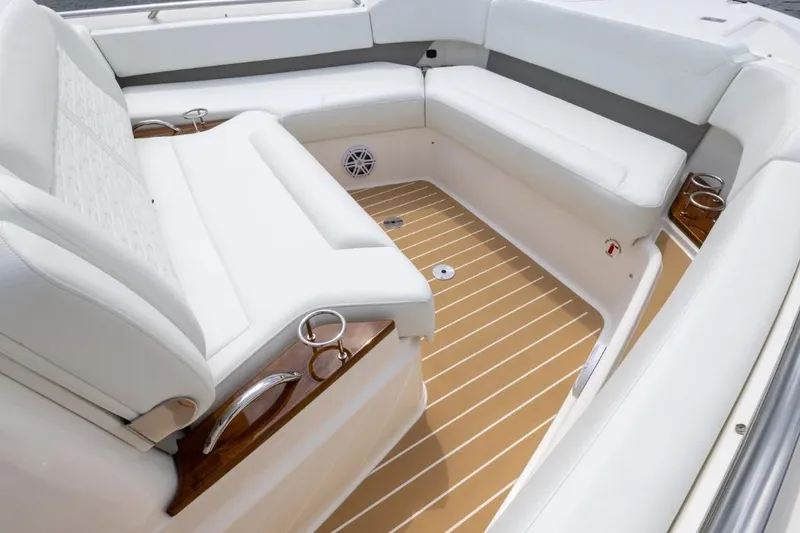 Slide: The Image of Luxurious seating area on 2026 Tiara Yachts 39 with elegant white upholstery and teak flooring. - 13