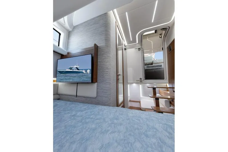 Slide: The Image of Interior of 2026 Tiara Yachts 39, featuring modern design and a mounted TV. - 21