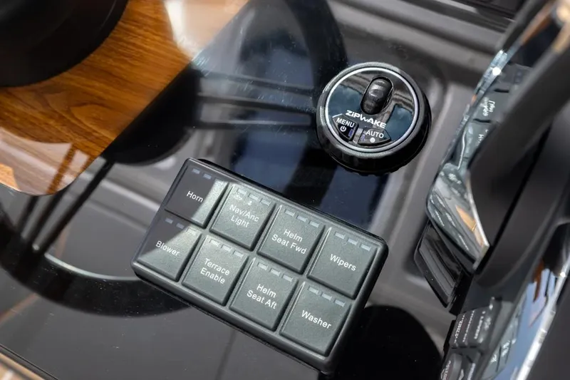 Slide: The Image of Control panel of 2026 Tiara Yachts 39 with Zipwake system and various switches. - 24