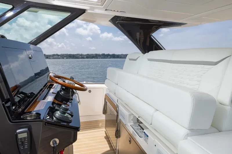 Slide: The Image of Luxurious interior of 2026 Tiara Yachts 39, featuring sleek helm and plush seating. - 10
