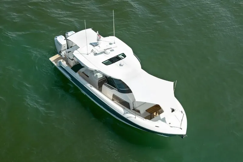 Slide: The Image of 2026 Tiara Yachts 39 cruising on open water, aerial view. - 4