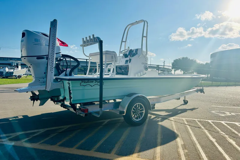 Slide: The Image of 2026 Shallow Sport 18 Sport boat on trailer, sunny day, outdoor setting. - 5