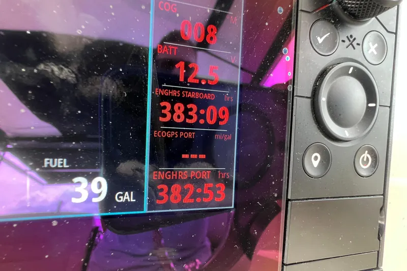 Slide: The Image of Close-up of 2019 Boston Whaler 315 Conquest dashboard displaying engine hours and fuel level. - 9