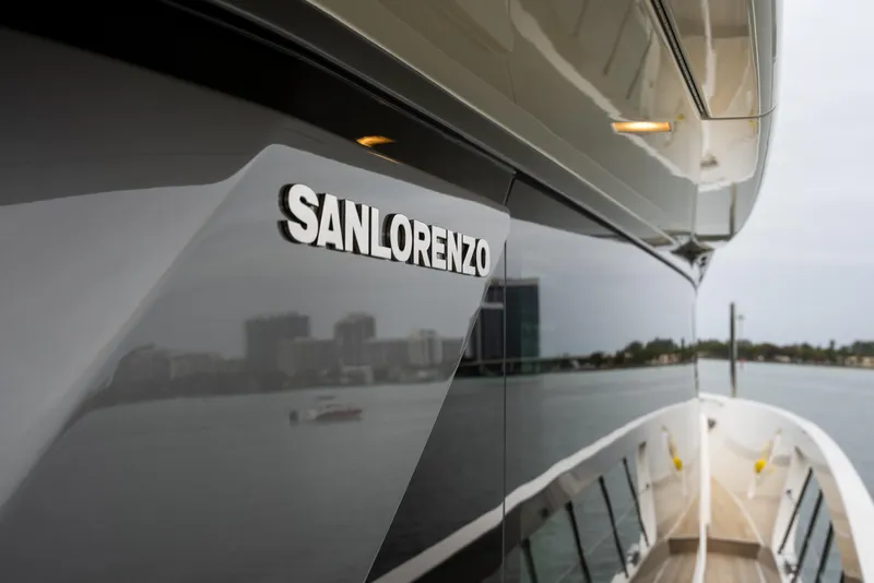 Slide: The Image of Sanlorenzo SX88 yacht, 2020 model, sleek design with cityscape reflection on water. - 119