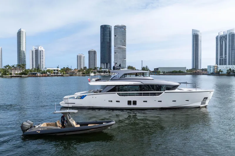 Slide: The Image of 2020 Sanlorenzo SX88 yacht cruising near modern city skyline. - 16