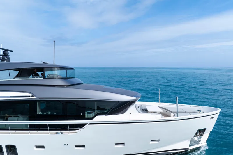 Slide: The Image of Luxurious 2020 Sanlorenzo SX88 yacht cruising on serene blue ocean waters. - 24