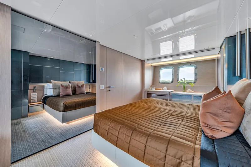 Slide: The Image of Luxurious Sanlorenzo SX88 2020 yacht bedroom with elegant decor and large windows. - 3