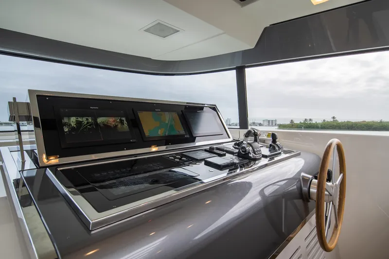 Slide: The Image of Control panel of 2020 Sanlorenzo SX88 yacht with navigation screens and steering wheel. - 45