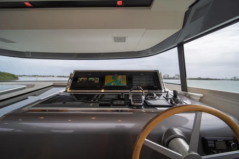 Slide: The Image of Helm of 2020 Sanlorenzo SX88 yacht with modern navigation controls and panoramic view. - 47