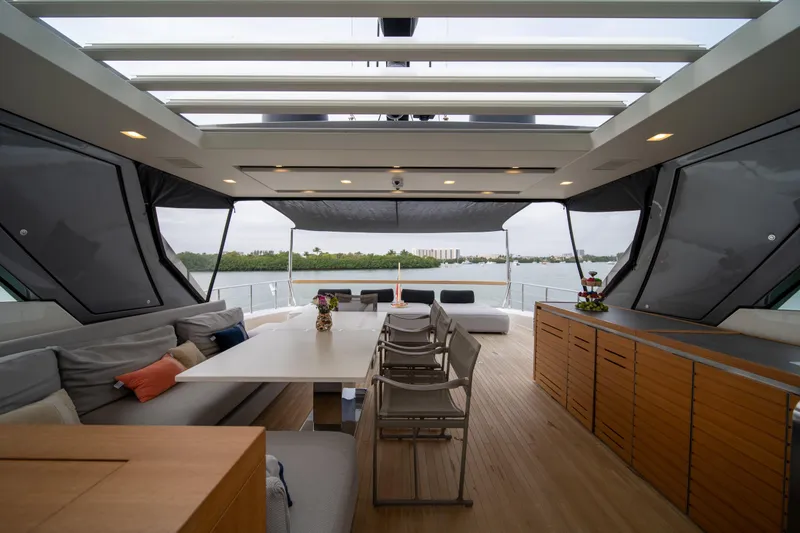 Slide: The Image of Luxurious 2020 Sanlorenzo SX88 yacht interior with modern seating and scenic water view. - 48