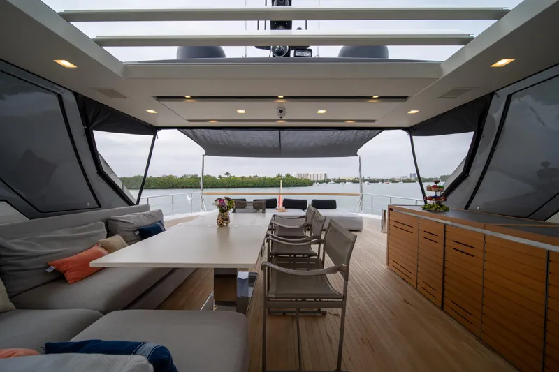 Slide: The Image of Luxurious 2020 Sanlorenzo SX88 yacht interior with elegant seating and dining area. - 49