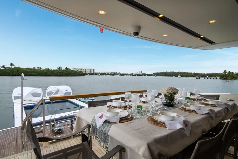 Slide: The Image of Luxurious dining setup on 2020 Sanlorenzo SX88 yacht with scenic waterfront view. - 53