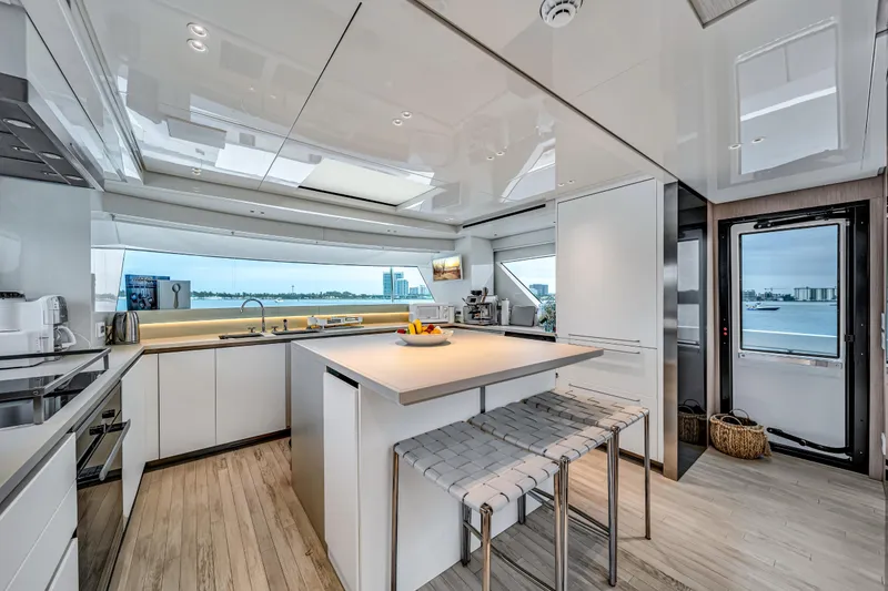 Slide: The Image of Luxurious 2020 Sanlorenzo SX88 yacht kitchen with modern design and waterfront view. - 6