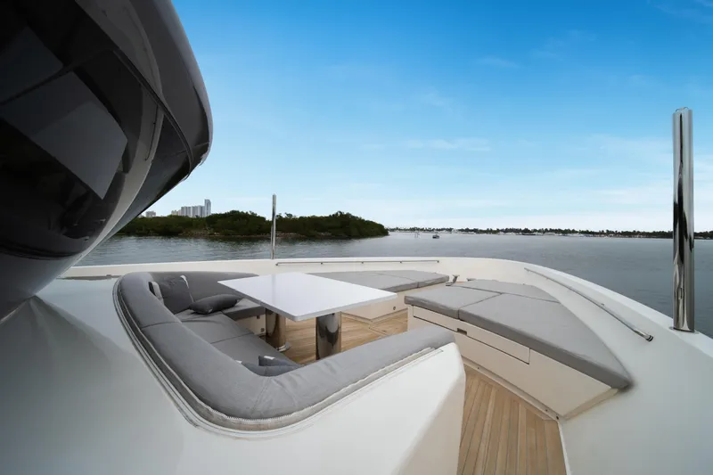 Slide: The Image of Luxurious 2020 Sanlorenzo SX88 yacht deck with elegant seating and scenic water view. - 7