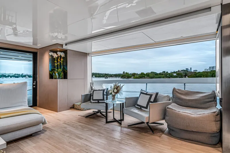 Slide: The Image of Luxurious interior of 2020 Sanlorenzo SX88 yacht with panoramic water views and elegant seating. - 71