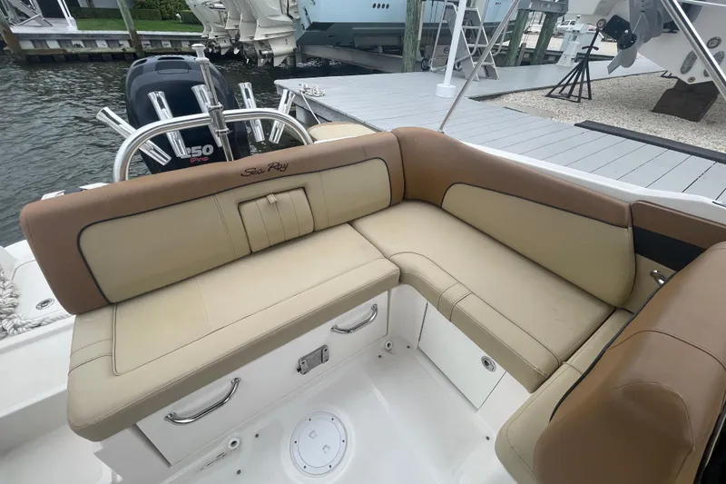 Slide: The Image of 2014 Sea Ray 240 Sundeck Outboard with tan seating and Yamaha 150 engine. - 11