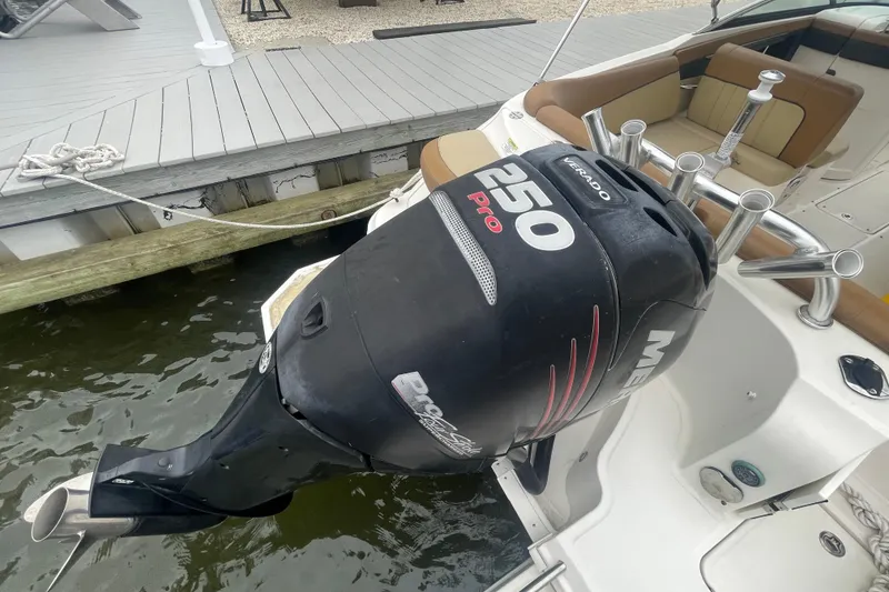Slide: The Image of 2014 Sea Ray 240 Sundeck Outboard with Mercury 250 Pro Verado engine at dock. - 13