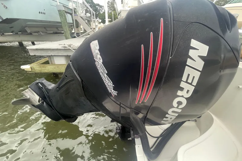 Slide: The Image of 2014 Sea Ray 240 Sundeck Outboard with Mercury engine at dockside. - 14