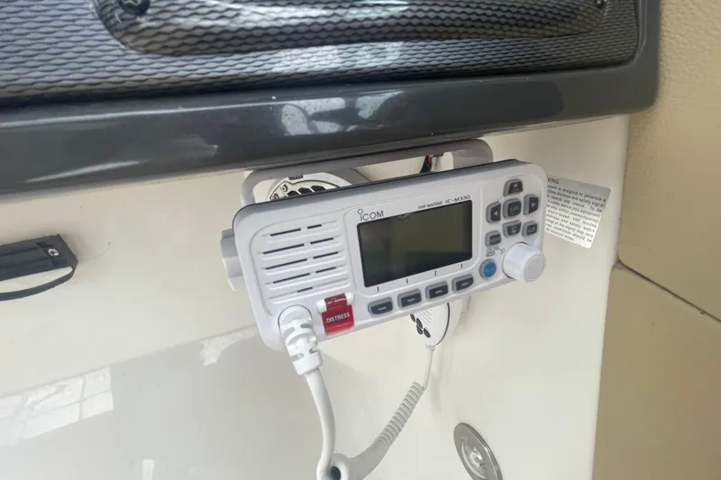 Slide: The Image of VHF marine radio on 2014 Sea Ray 240 Sundeck Outboard boat dashboard. - 9