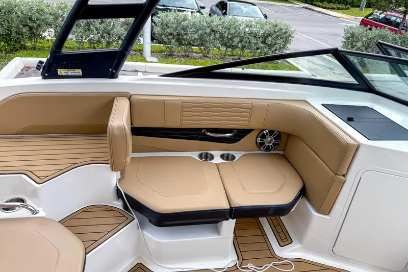 Slide: The Image of 2023 Sea Ray 19 SPX OB boat interior with tan seating and modern design. - 3