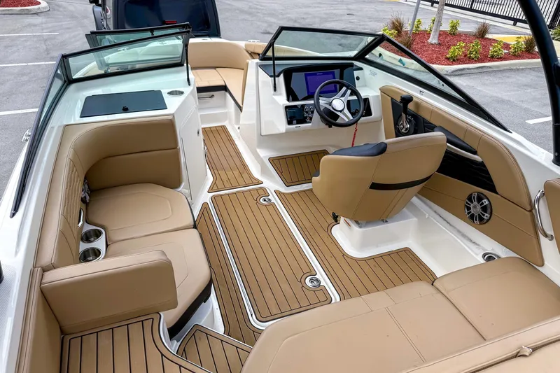 Slide: The Image of 2023 Sea Ray 19 SPX OB boat interior with tan seating and modern dashboard. - 4