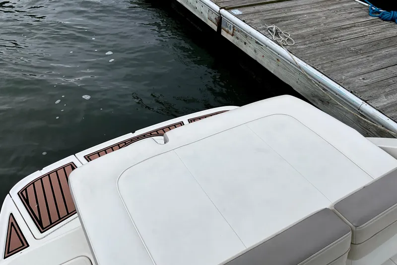 Slide: The Image of 2013 Sea Ray 280 Sundeck at dock, featuring sleek design and spacious deck. - 16