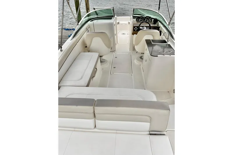 Slide: The Image of 2013 Sea Ray 280 Sundeck interior with seating, helm, and water view. - 3