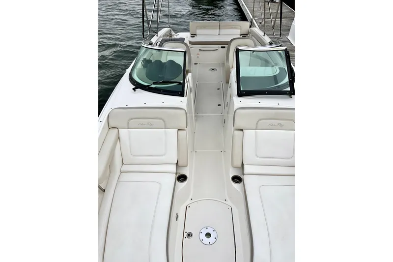 Slide: The Image of 2013 Sea Ray 280 Sundeck boat interior with white seating and windshield. - 4