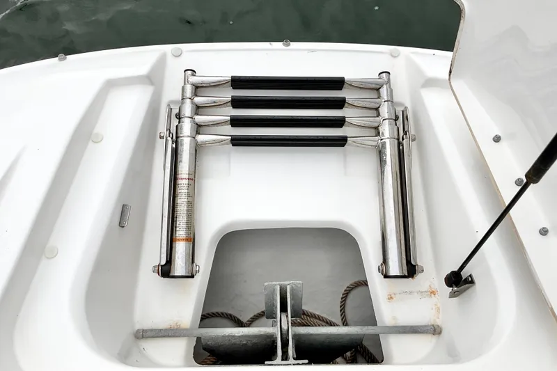 Slide: The Image of 2013 Sea Ray 280 Sundeck boat ladder and anchor storage compartment. - 6