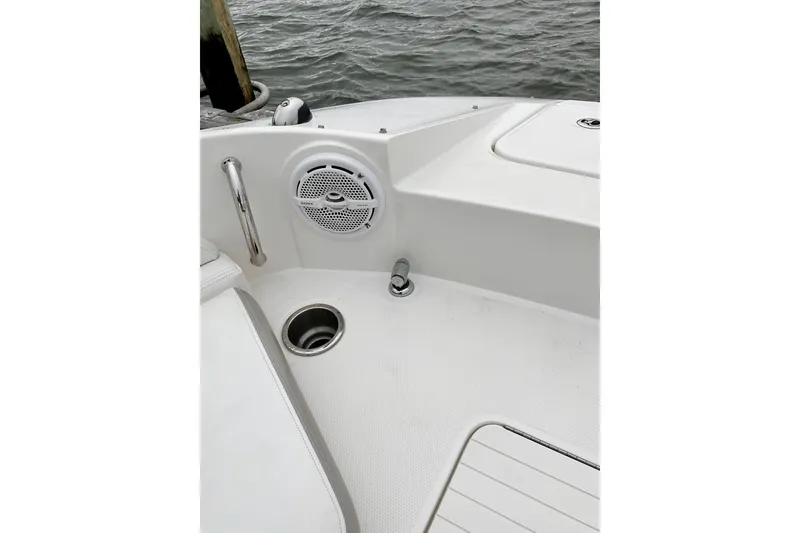 Slide: The Image of 2013 Sea Ray 280 Sundeck boat interior with speaker and cup holder. - 7