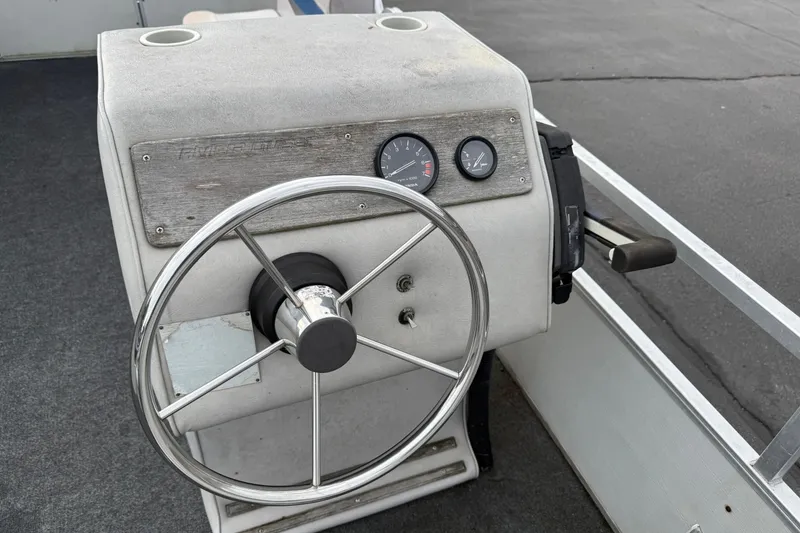 Slide: The Image of 1989 Riviera Cruiser Fun Deck 22 steering console with gauges and controls. - 12