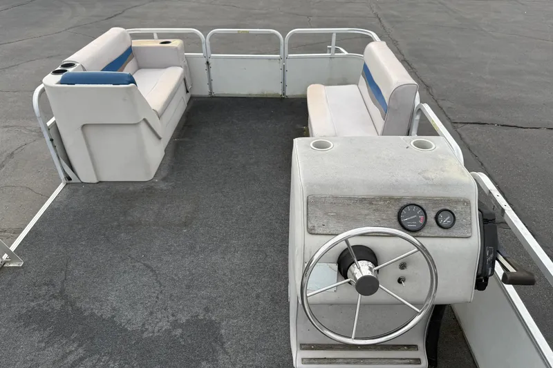Slide: The Image of 1989 Riviera Cruiser Fun Deck 22 interior with steering wheel and seating. - 13
